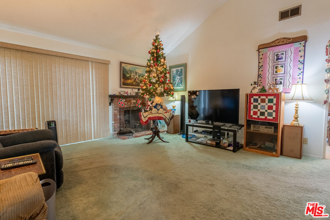 1637 Downing Street Simi Valley, CA 93065 - Photo 21 of 26 a view of a livingroom with furniture and a flat screen tv