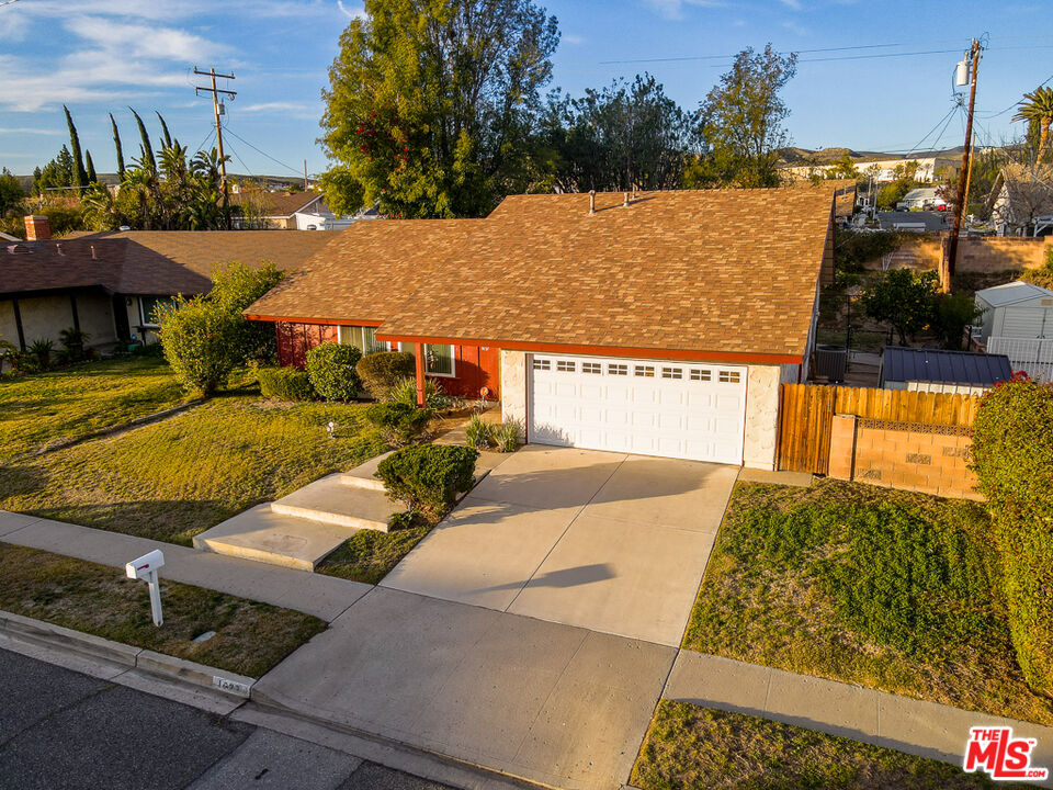1637 Downing Street Simi Valley, CA 93065 - Photo 3 of 26 a view of a swimming pool with a yard