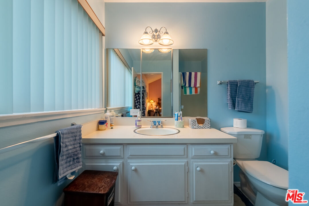 1637 Downing Street Simi Valley, CA 93065 - Photo 8 of 26 a bathroom with a sink and a mirror