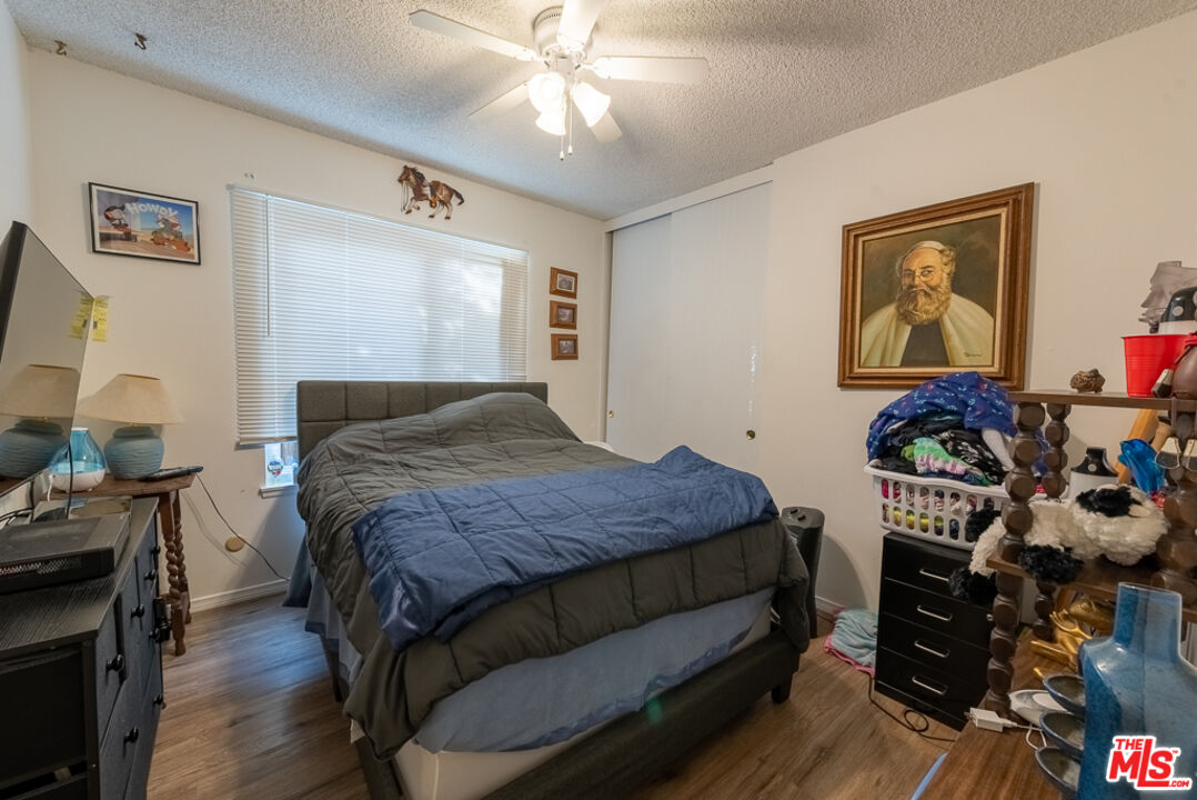1637 Downing Street Simi Valley, CA 93065 - Photo 10 of 26 a bedroom with a bed and a flat tv screen on dresser