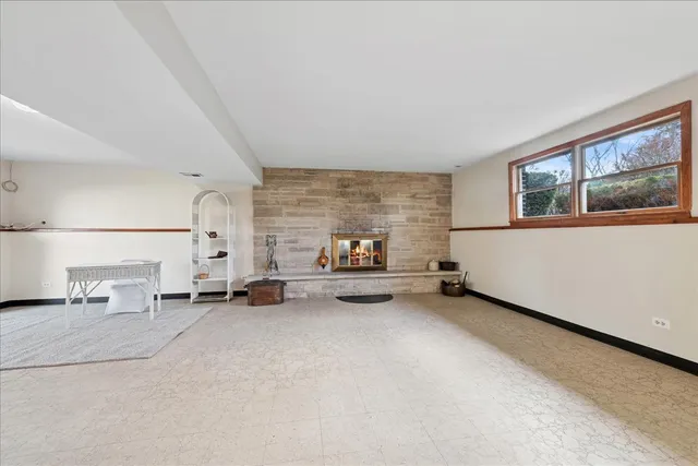 a view of a livingroom with furniture and a window