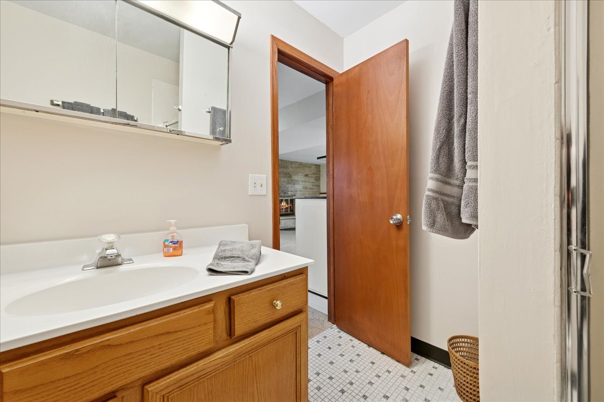23565 North Park Road Lake Zurich, IL 60047 - Photo 19 of 26 a bathroom with a sink and a mirror