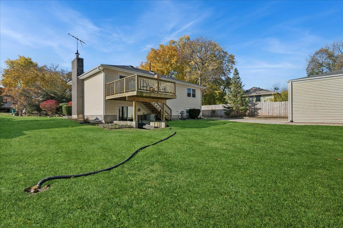 23565 North Park Road Lake Zurich, IL 60047 - Photo 2 of 26 a front view of a house with a yard and garage