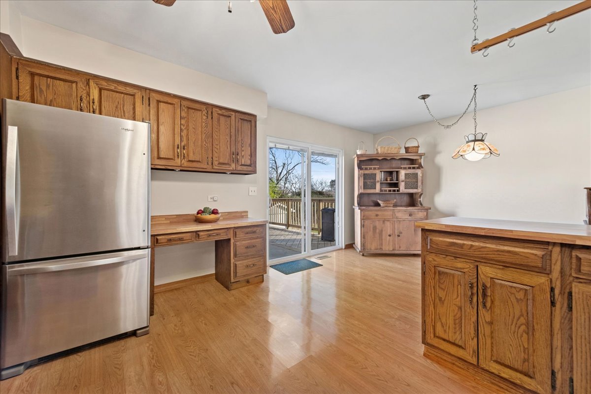 23565 North Park Road Lake Zurich, IL 60047 - Photo 8 of 26 a kitchen with granite countertop a refrigerator stove top oven and cabinets