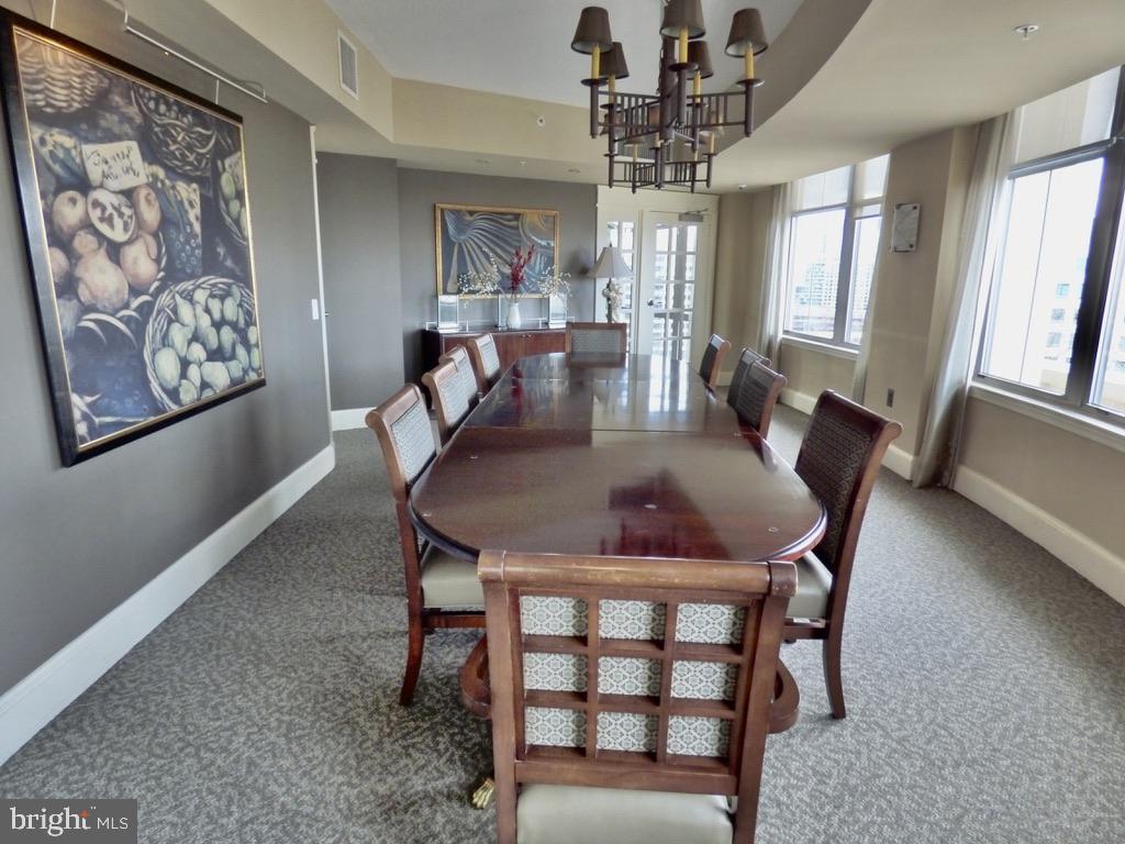11800 Sunset Hills Road, Unit 118 Reston, VA 20190 - Photo 42 of 52 Elegant dining space with city views.