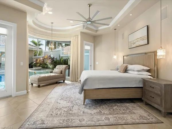 a bedroom with a bed and a couch