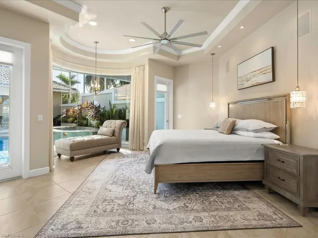 a bedroom with a bed and a couch