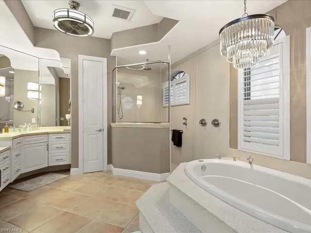 a bathroom with a sink a mirror and a bathtub