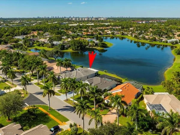an aerial view of a house with a swimming pool