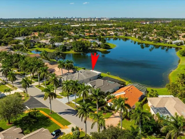 an aerial view of a house with a swimming pool