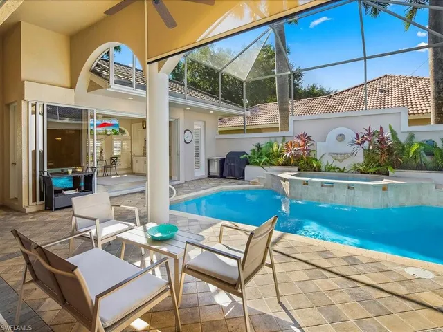 a view of a chairs and table in the patio