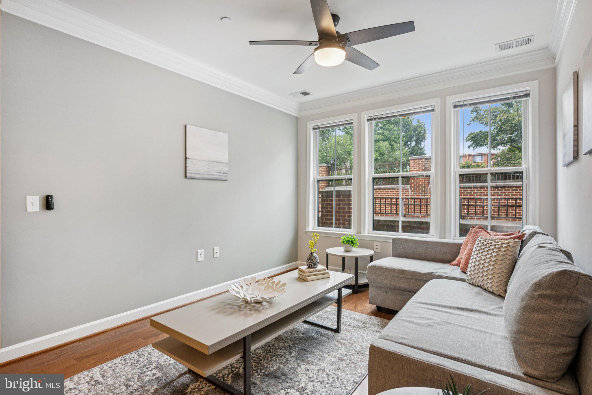 2101 North Monroe Street, Unit 107 Arlington, VA 22207 - Photo 12 of 24 a living room with furniture and a window