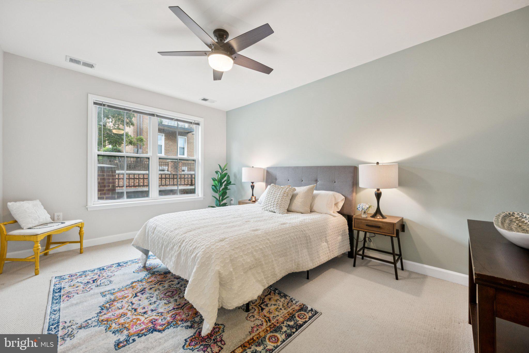 2101 North Monroe Street, Unit 107 Arlington, VA 22207 - Photo 13 of 24 a bedroom with a bed and a large window