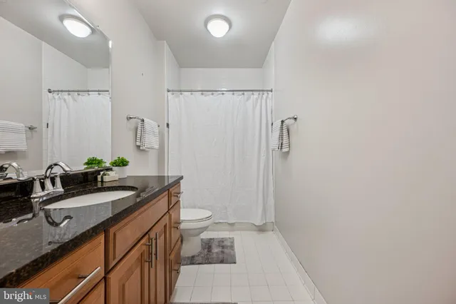 a view of staircase with white walls and railing