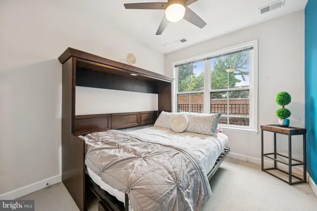 a bedroom with a bed and a shower