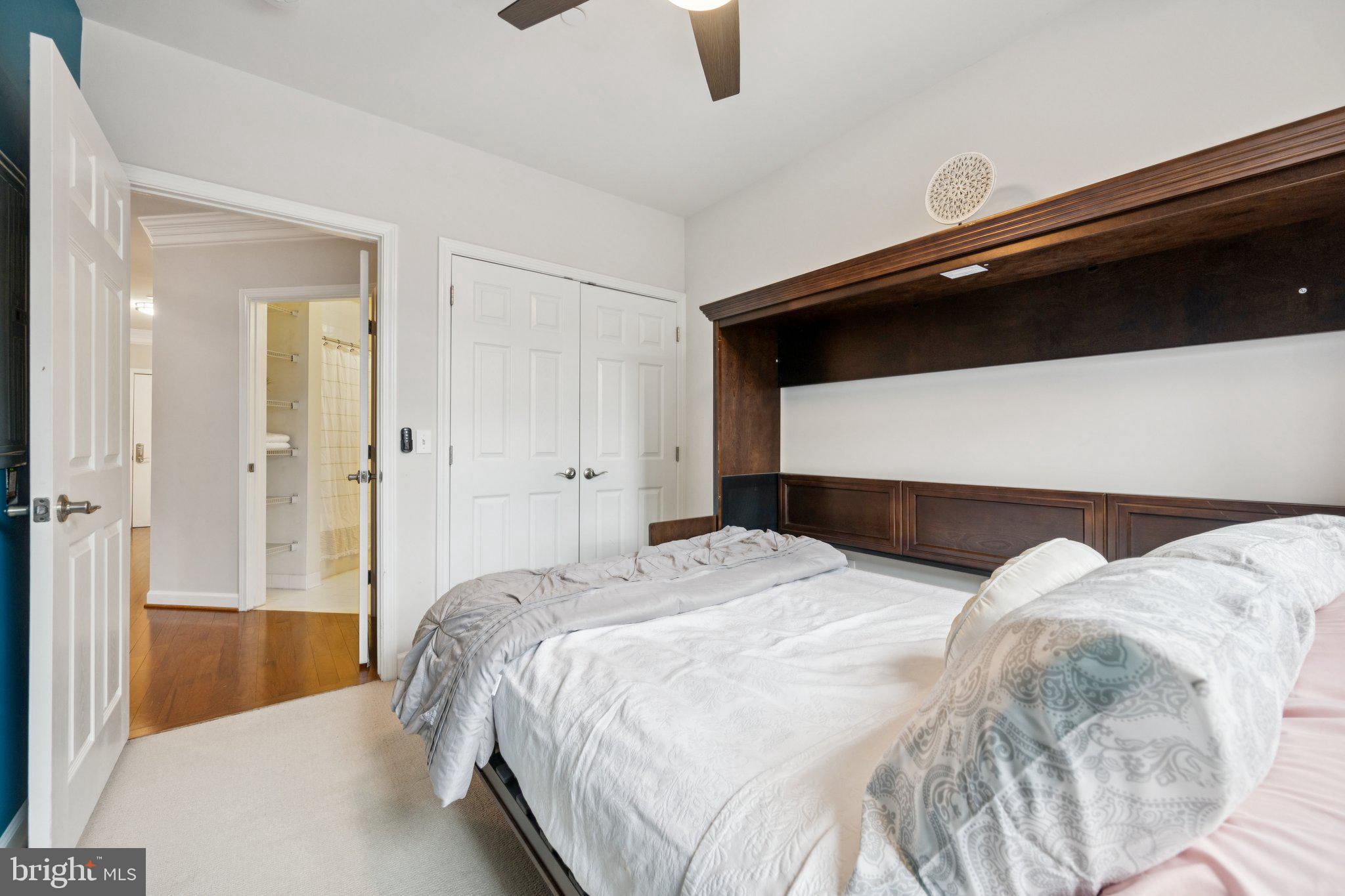 2101 North Monroe Street, Unit 107 Arlington, VA 22207 - Photo 20 of 24 a bedroom with a bed and a shower