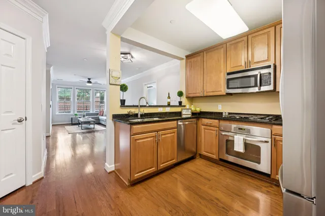 a kitchen with a refrigerator sink and microwave