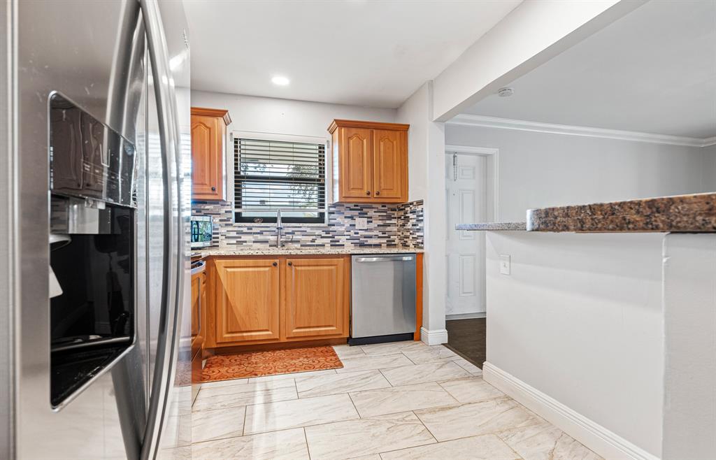 502 Osprey Drive, Unit 17C Delray Beach, FL 33444 - Photo 12 of 41 a view of a kitchen with a sink