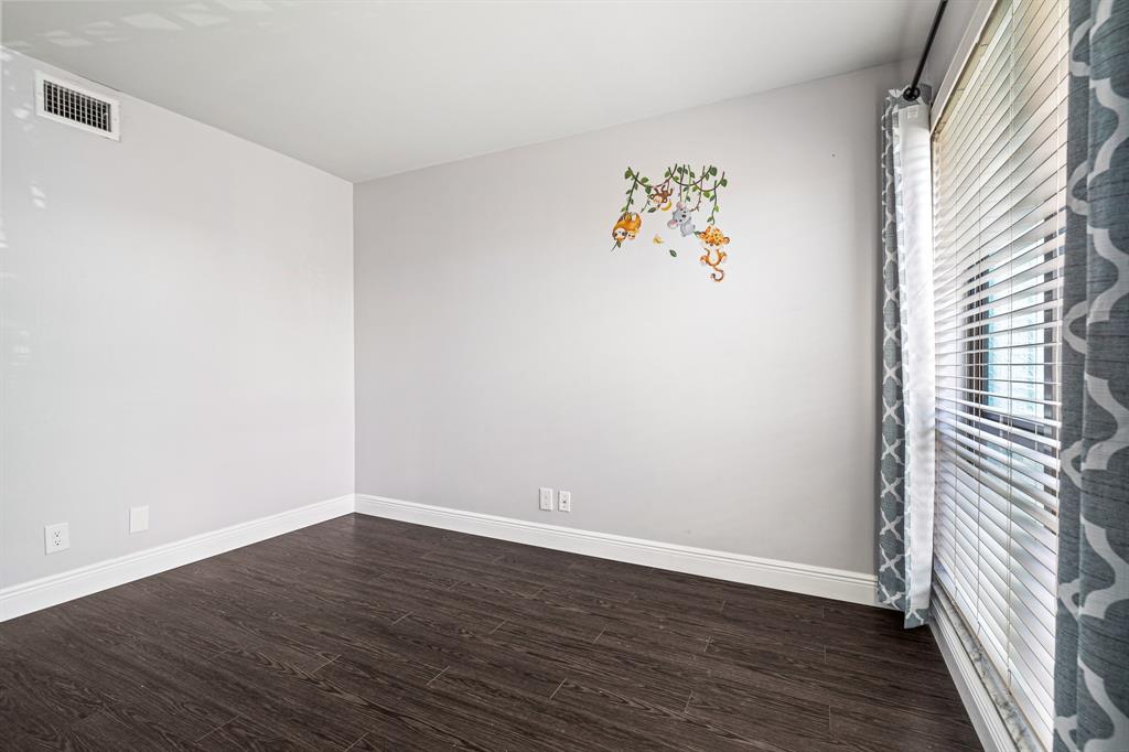 502 Osprey Drive, Unit 17C Delray Beach, FL 33444 - Photo 17 of 41 a view of a room with wooden floor and window