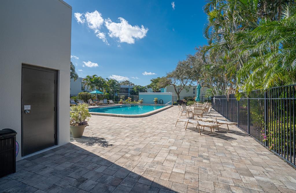 502 Osprey Drive, Unit 17C Delray Beach, FL 33444 - Photo 38 of 41 a view of outdoor space yard and swimming pool