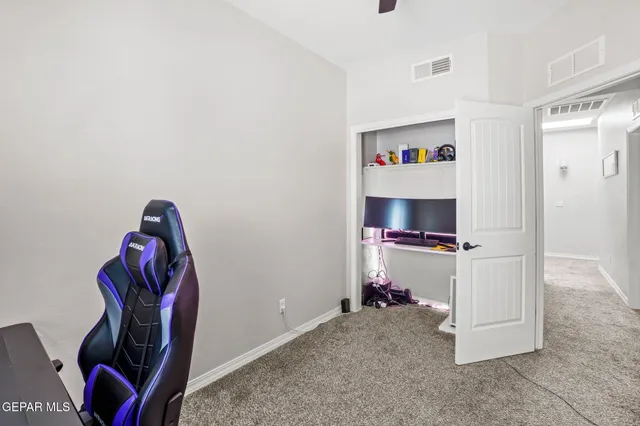 a view of a workspace with furniture