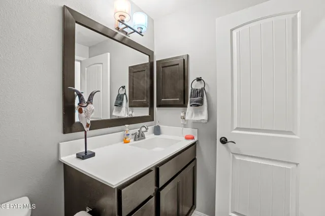 a bathroom with a sink double vanity and a mirror
