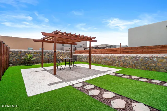 a view of a park with a big yard and large trees