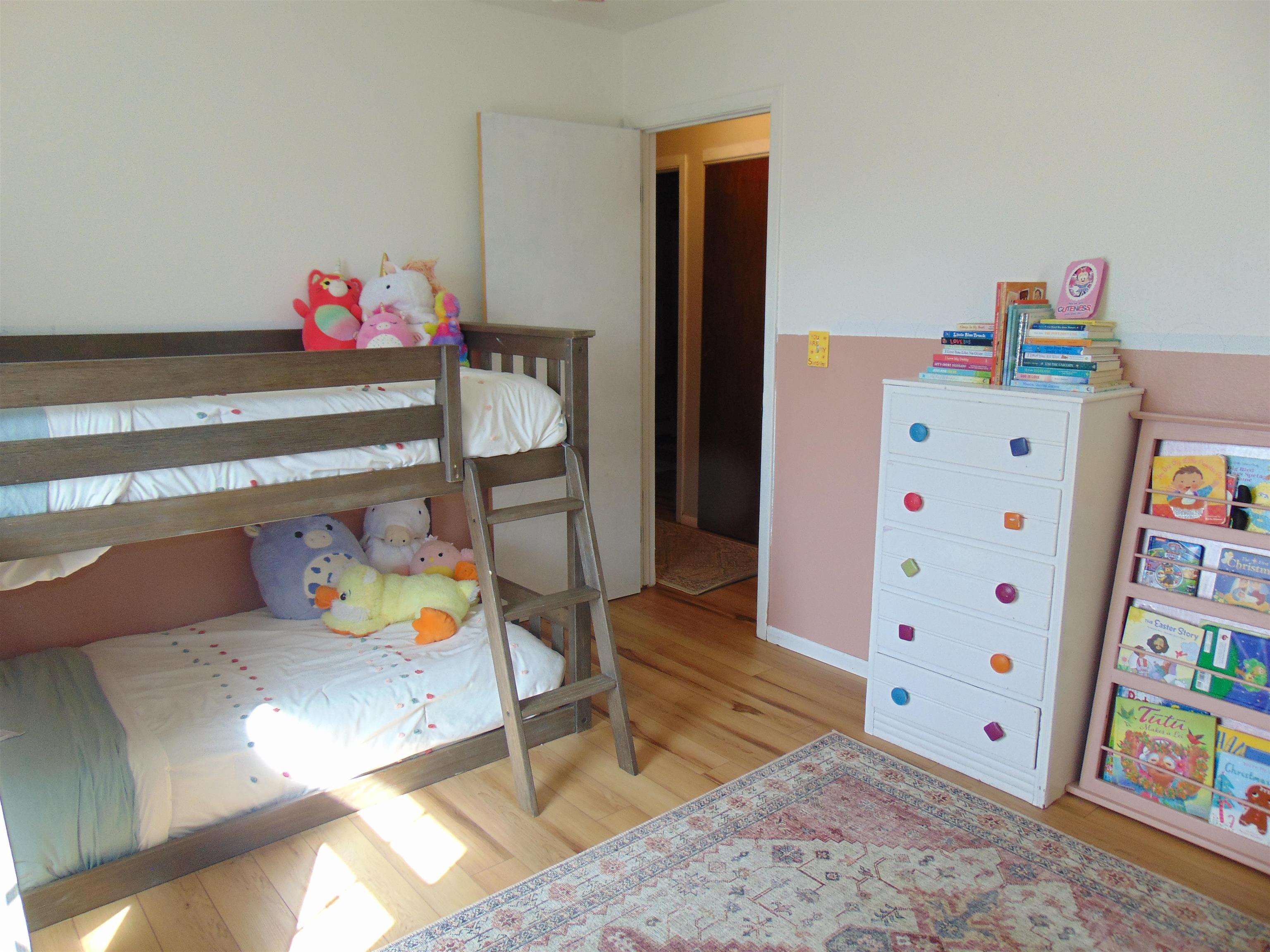 321 North Ash Street Fruita, CO 81521 - Photo 16 of 24 a children room with furniture and wooden floor