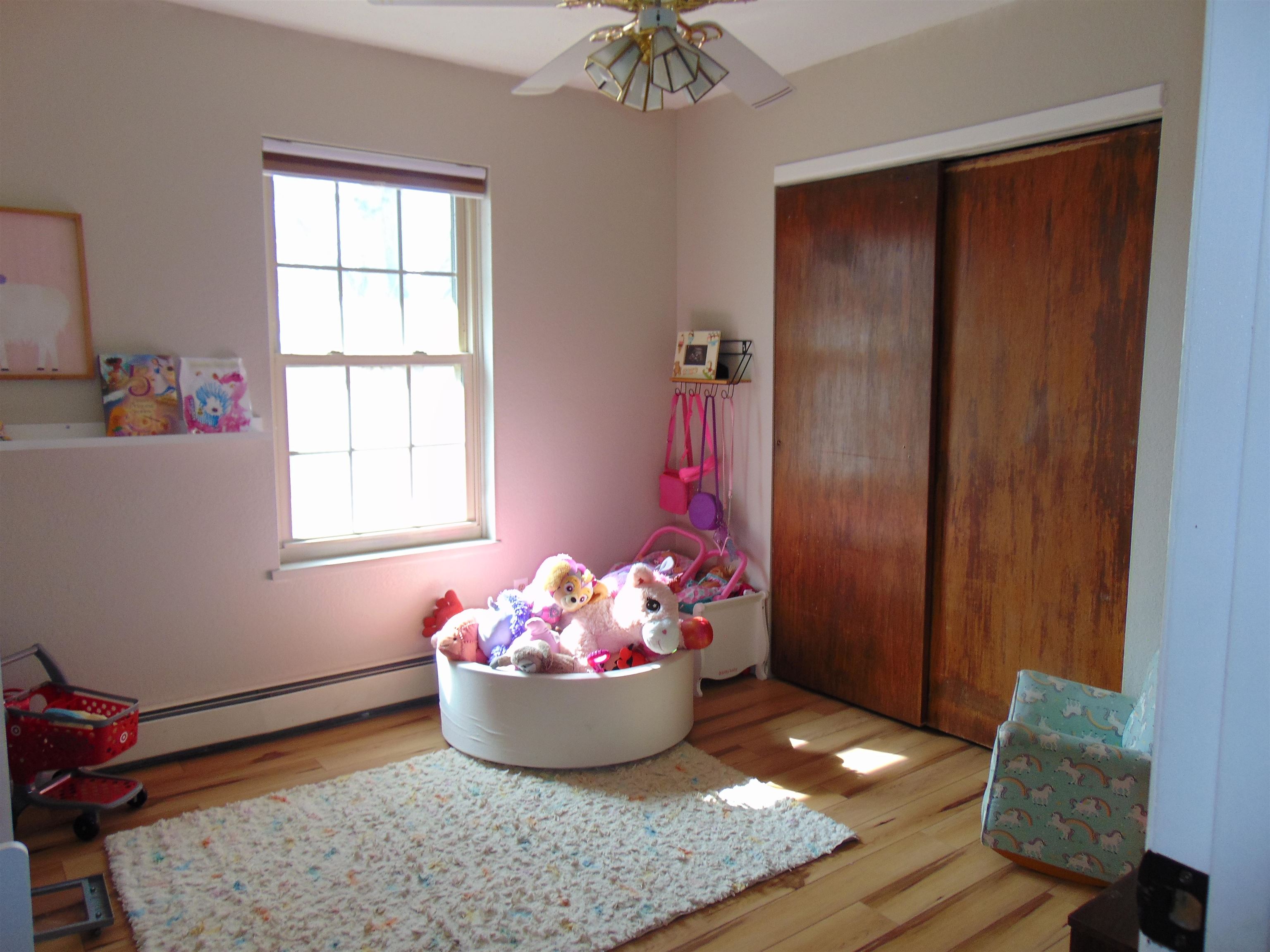321 North Ash Street Fruita, CO 81521 - Photo 17 of 24 a room with a window and chandelier