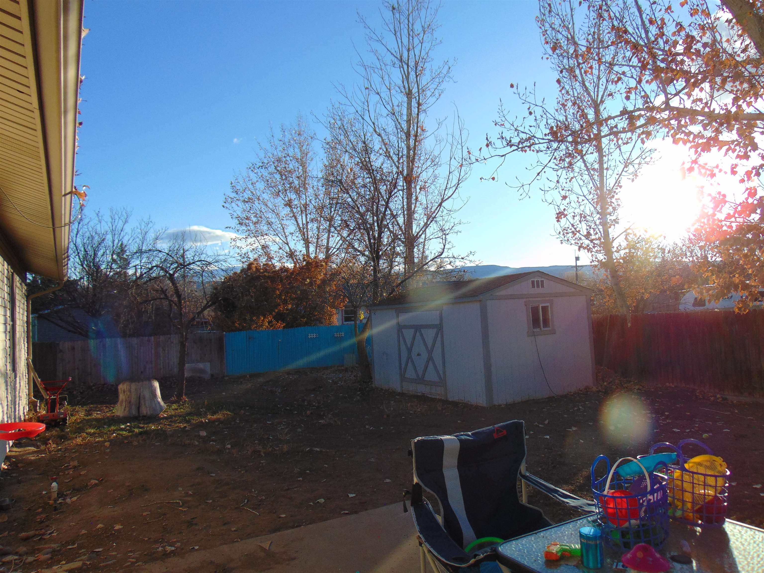 321 North Ash Street Fruita, CO 81521 - Photo 20 of 24 a view of backyard with barbeque grill and outdoor seating