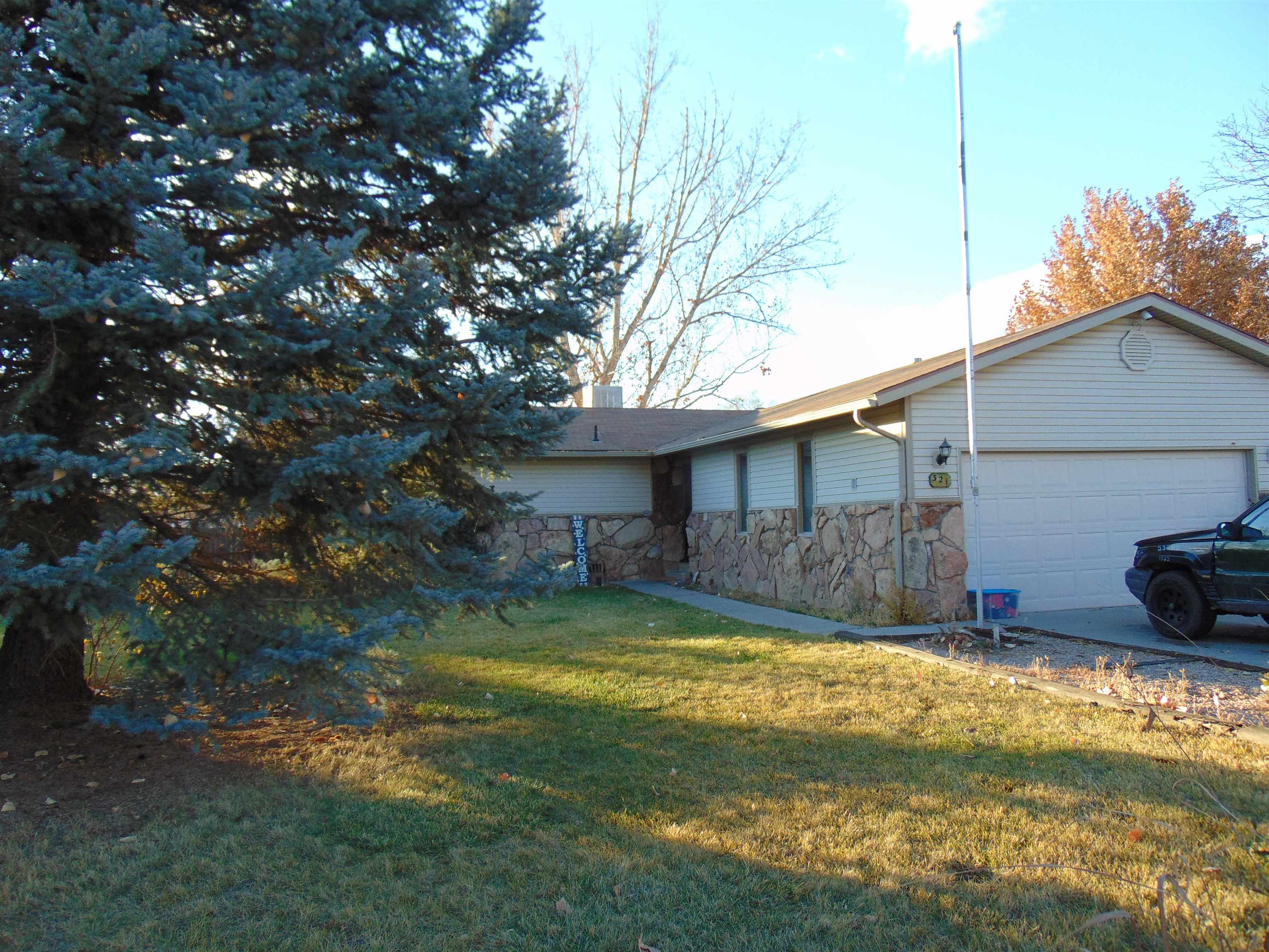 321 North Ash Street Fruita, CO 81521 - Photo 2 of 24 a view of a house with a yard