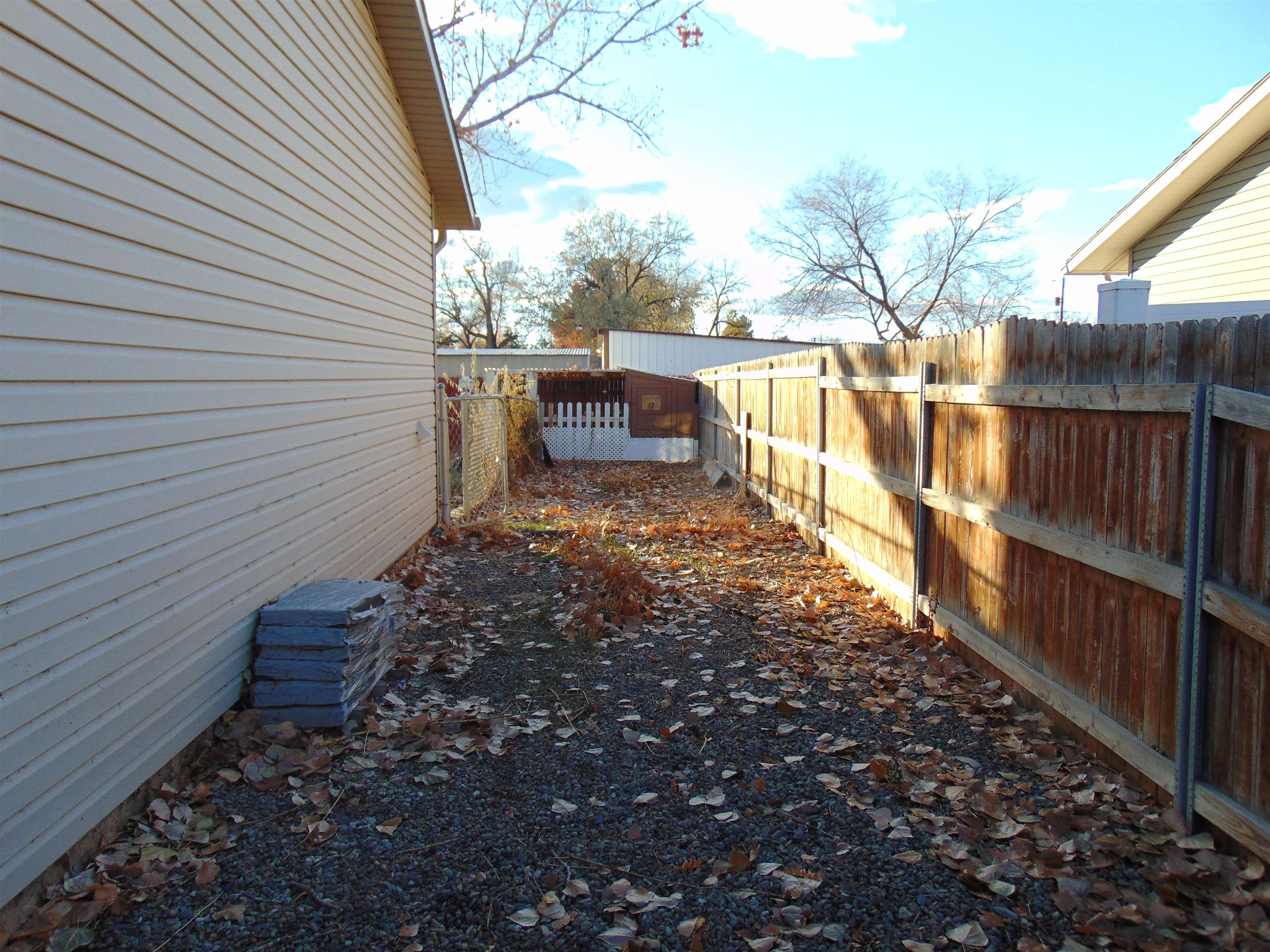 321 North Ash Street Fruita, CO 81521 - Photo 23 of 24 a view of a pathway with a wrought fence