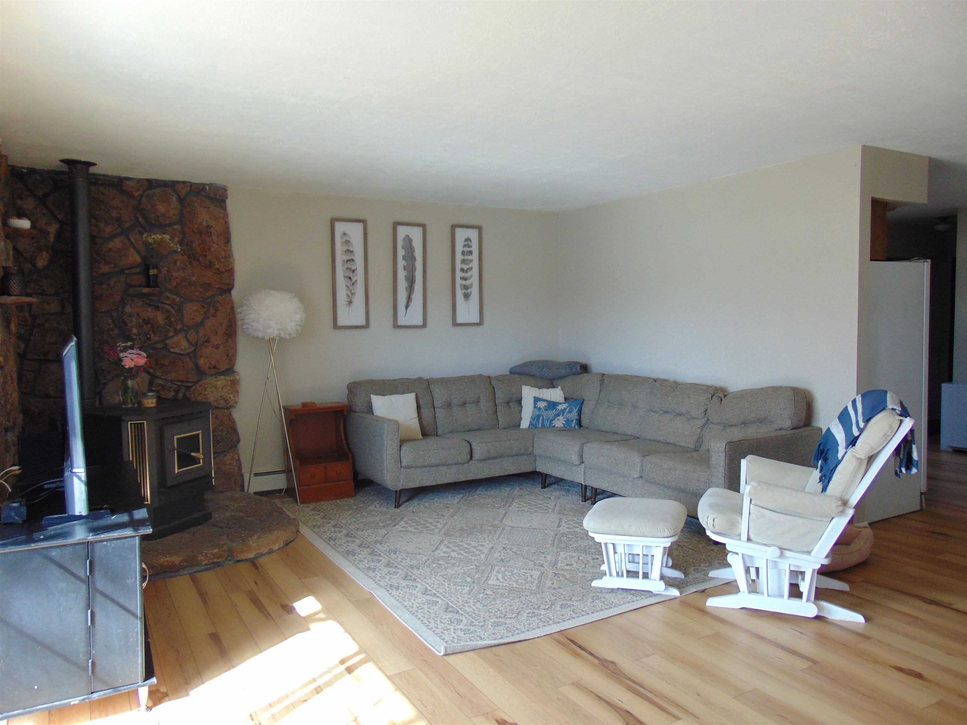 321 North Ash Street Fruita, CO 81521 - Photo 4 of 24 a living room with furniture and a fireplace