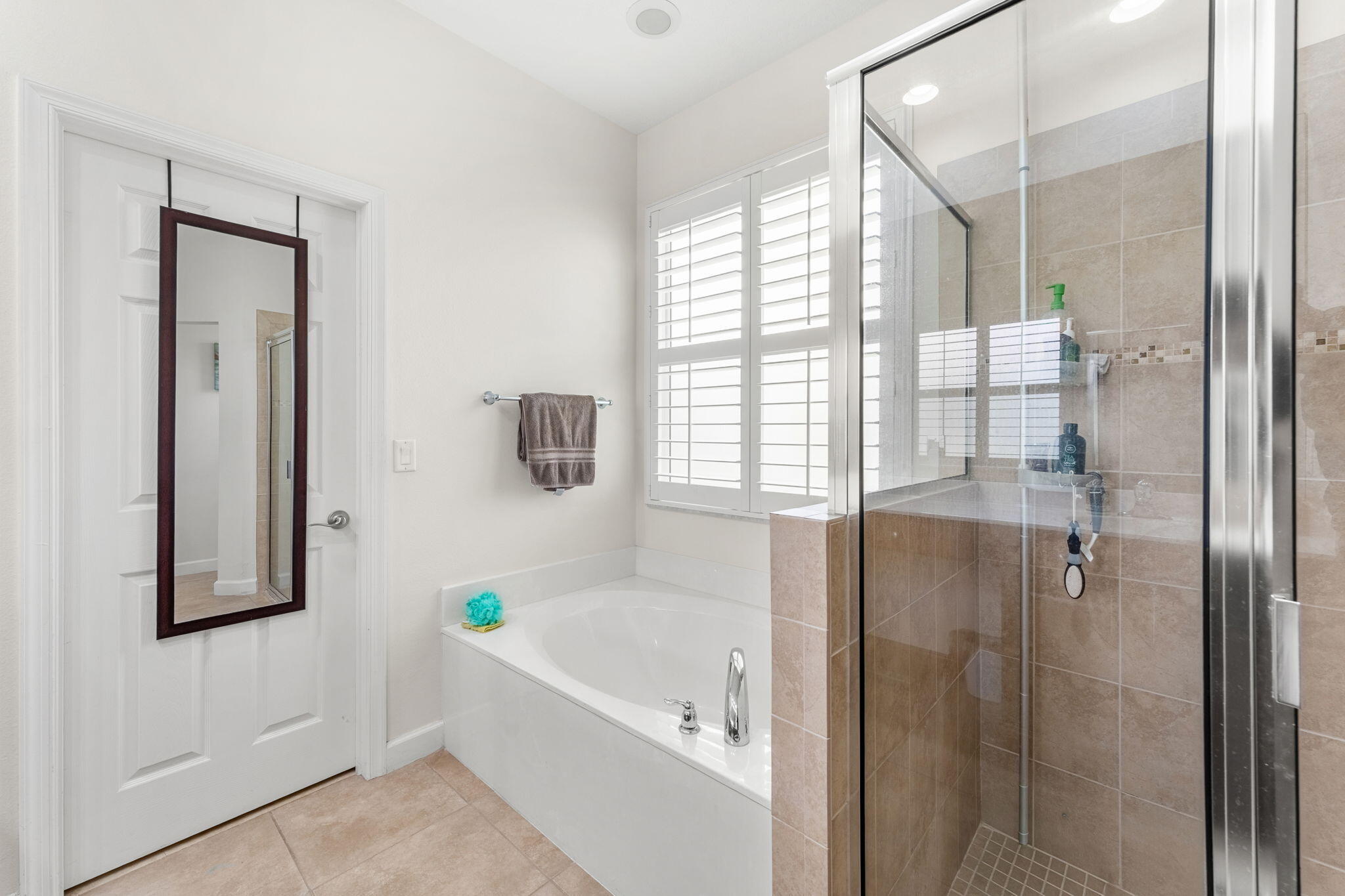 7657 Fieldstone Ranch Square Vero Beach, FL 32967 - Photo 28 of 52 a bathroom with a bathtub and shower
