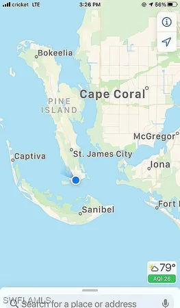 a house view with a sitting space and garden