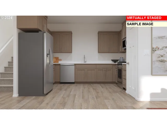 a kitchen with a sink and refrigerator