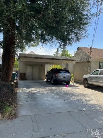 a view of a car parked in back of a house