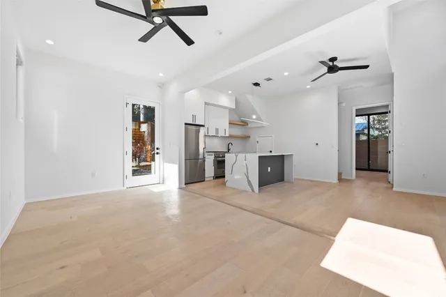 a view of an empty room with a window