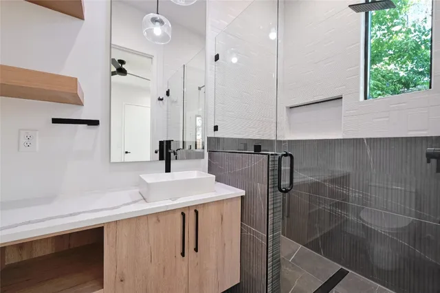 a kitchen with a sink a counter top space and cabinets