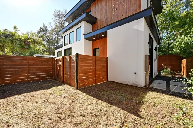 a view of backyard with cabin