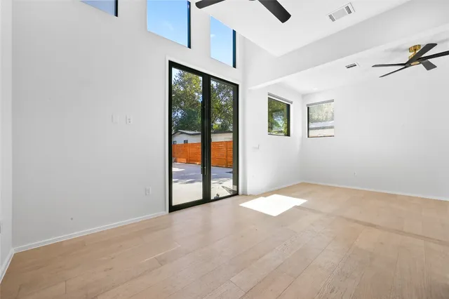 a view of kitchen with stainless steel appliances cabinets and wooden floor