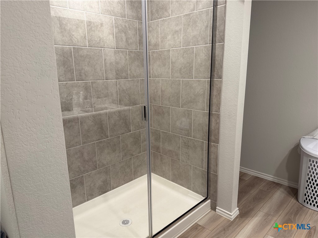 1335 Brookfield Street Temple, TX 76504 - Photo 11 of 15 a bathroom with a glass shower door