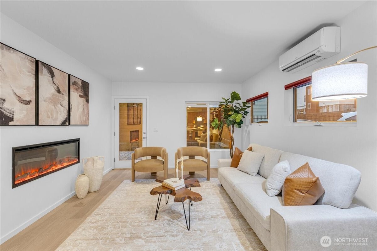 1722 Northwest 60th Street Seattle, WA 98107 - Photo 11 of 37 a living room with furniture and a fireplace