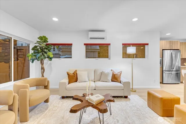 a living room with furniture and a potted plant