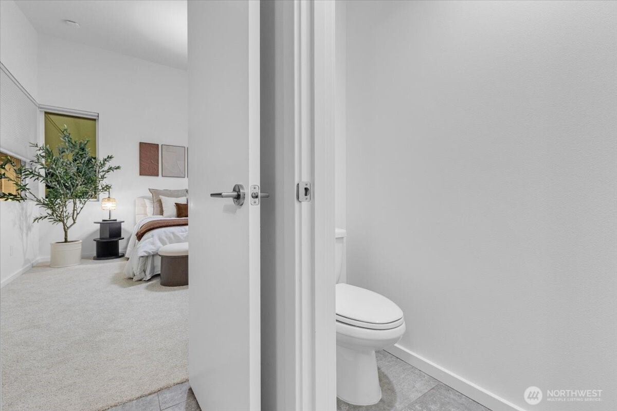 1722 Northwest 60th Street Seattle, WA 98107 - Photo 19 of 37 a bathroom with a toilet and a shower