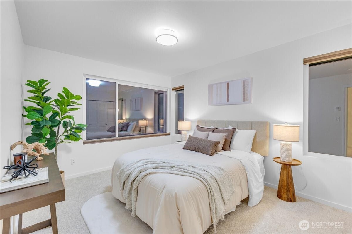1722 Northwest 60th Street Seattle, WA 98107 - Photo 21 of 37 a bedroom with a bed and a potted plant