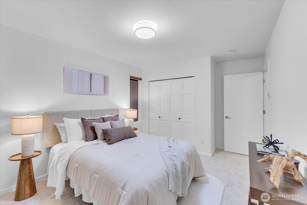 1722 Northwest 60th Street Seattle, WA 98107 - Photo 22 of 37 a bedroom with a bed and a night stand