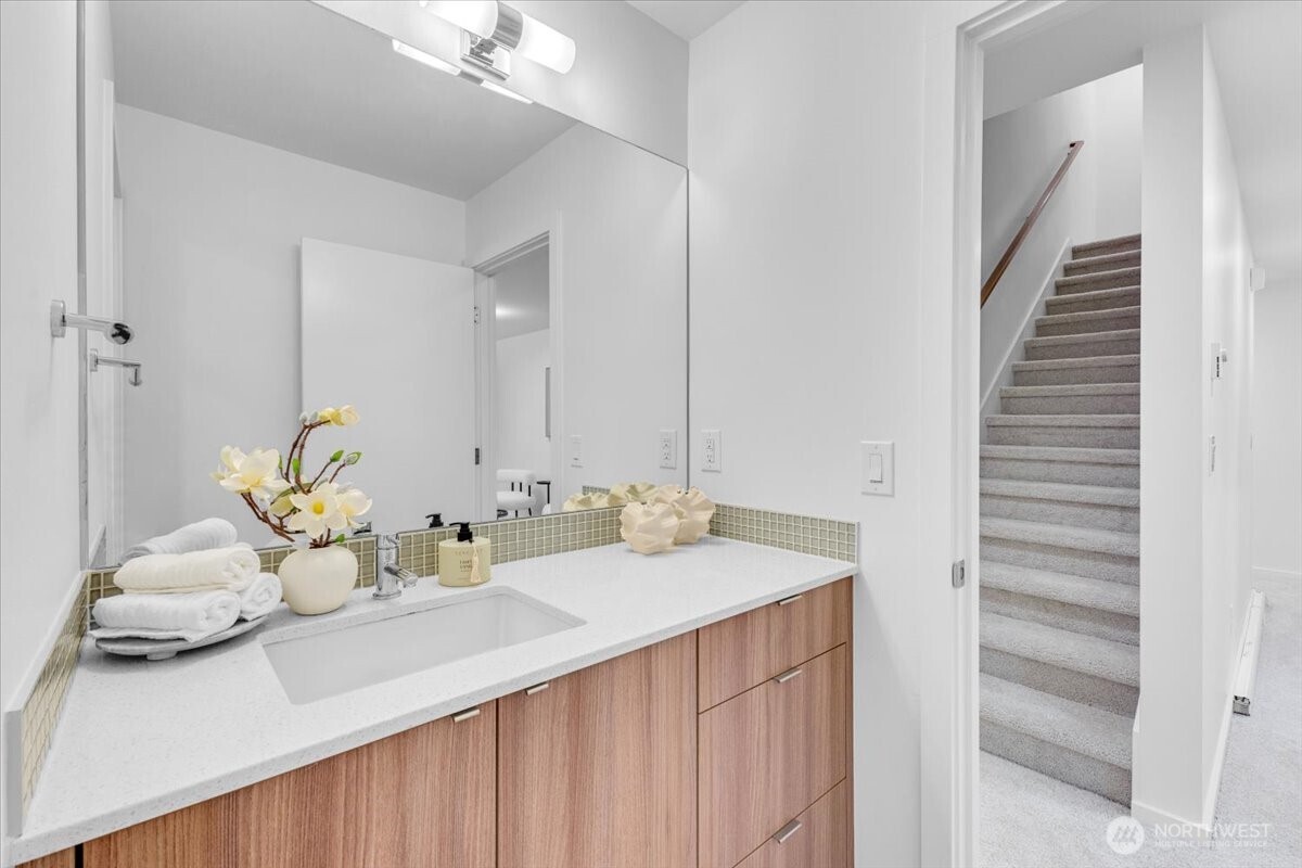 1722 Northwest 60th Street Seattle, WA 98107 - Photo 24 of 37 a bathroom with a sink and a mirror