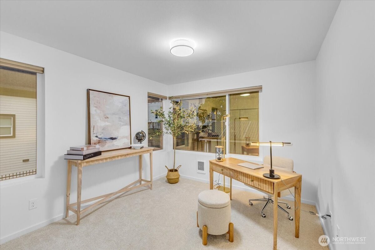 1722 Northwest 60th Street Seattle, WA 98107 - Photo 27 of 37 a very nice looking room with a large window and white walls