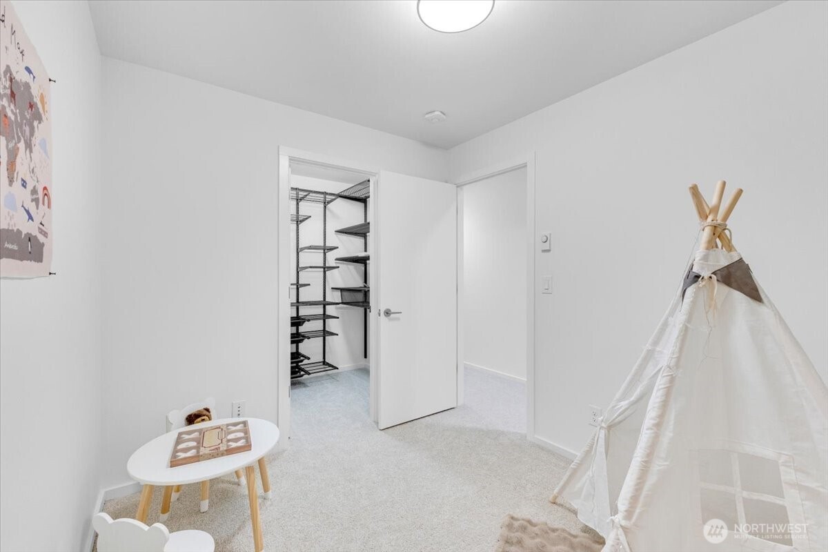 1722 Northwest 60th Street Seattle, WA 98107 - Photo 31 of 37 a living room with furniture and white walls